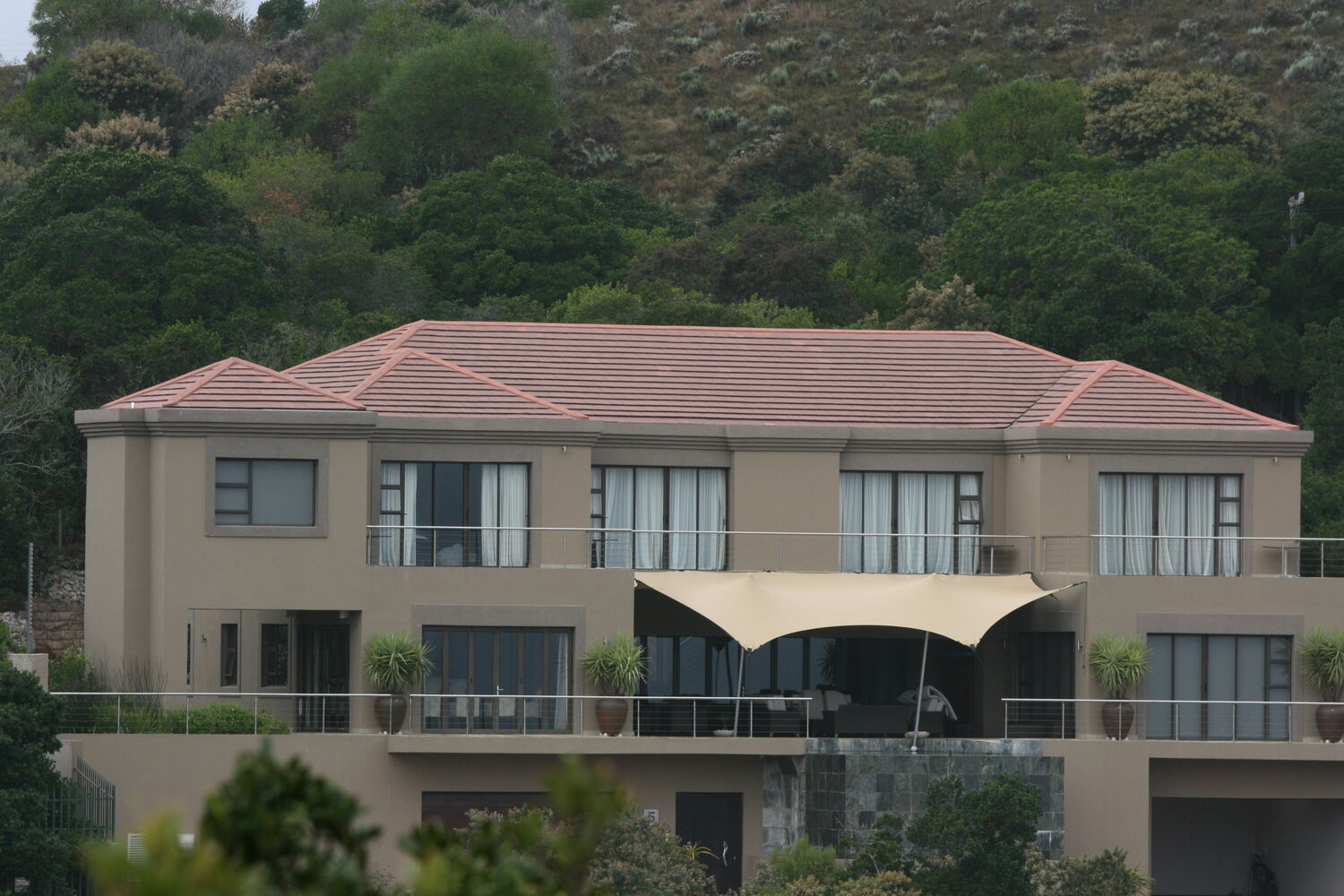 A canopy fitted over the balcony of a private home