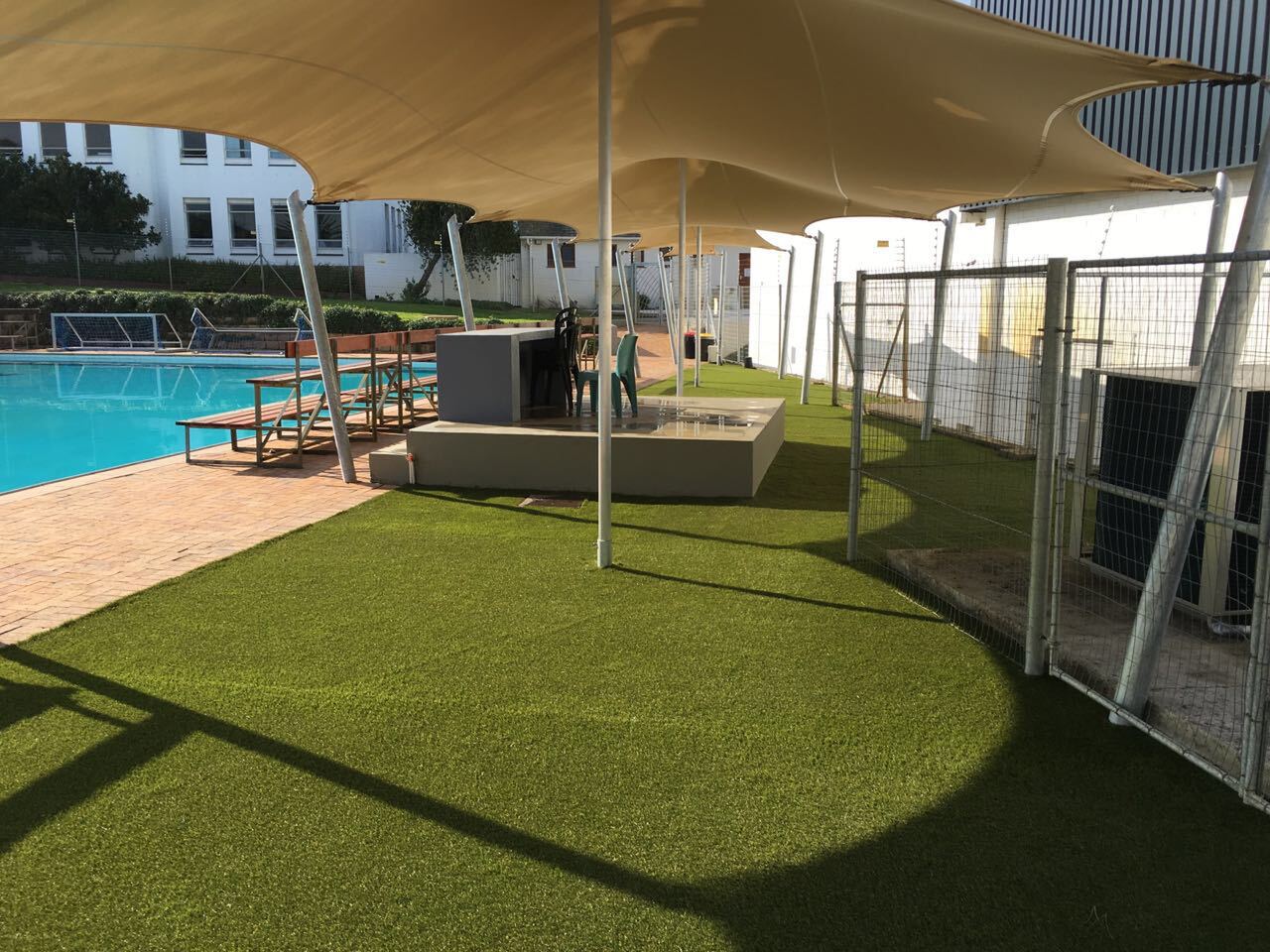 A chino canopy shading a pool deck