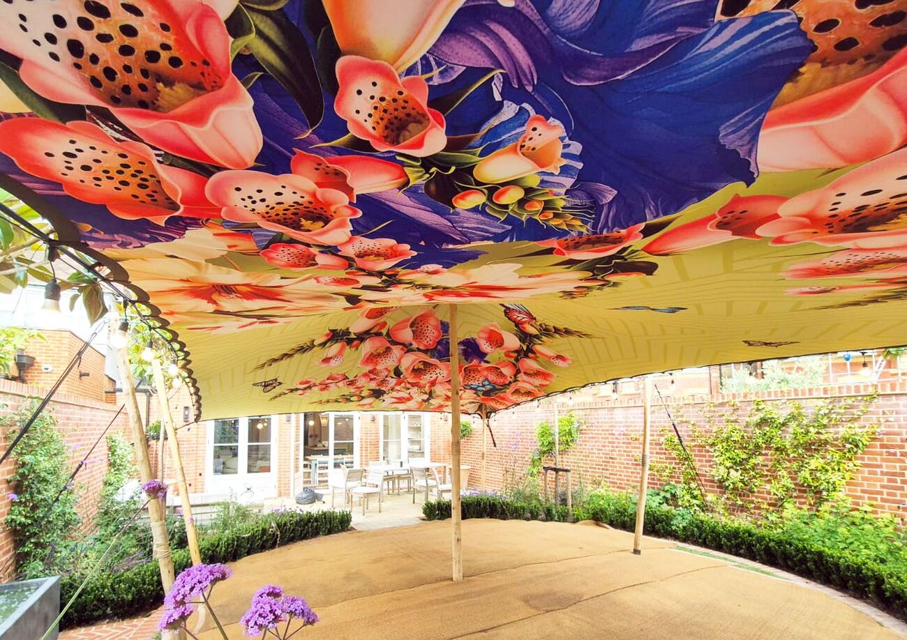 A floral printed lining over a garden terrace
