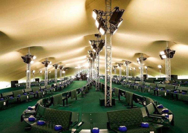 A printed lining seen from inside a large furnished tent